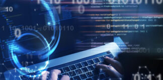 5 Reasons Hardware Companies Need to Invest in Software technologist on keyboard writing software code with digital code overlaying picture