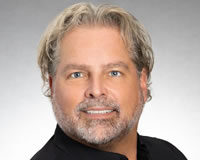 Nik Froehlich Headshot of President and CEO Nik Froehlich