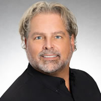Headshot of President and CEO Nik Froehlich