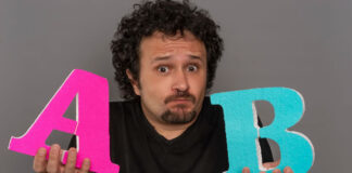 Sticky Header or No Header? A Comprehensive Guide to A/B Testing man holding up the letters A and B representing split testing