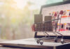 Three Important Considerations for New Online Marketplaces picture of a miniature shopping cart sitting on a laptop representing the online marketplace