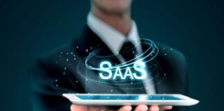 What to Consider Before Launching a Subscription Model businessman holding a tablet representing a SaaS subscription model