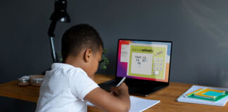 Bot Technology Used in Schools Can Help Retrain and Upskill Workers child student studying at a laptop using bot technology