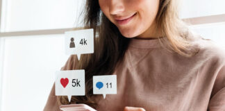 Cloutdesk: Building Open Infrastructure for Influencer Marketing woman using her phone for influencer marketing on the Cloutdesk app