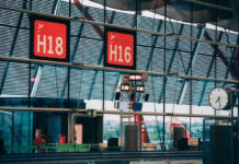 How Crowdsourced Data Could Affect Change Among Airlines red airport terminal signs showing how crowdsourced data could affect change among airlines