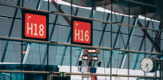 How Crowdsourced Data Could Affect Change Among Airlines red airport terminal signs showing how crowdsourced data could affect change among airlines