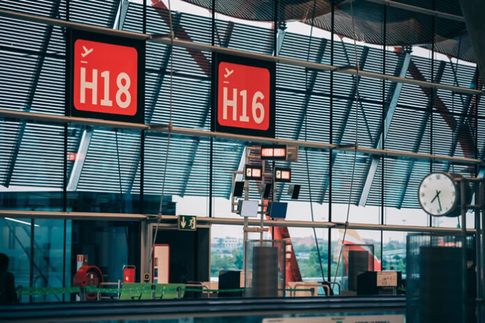 red airport terminal signs showing how crowdsourced data could affect change among airlines