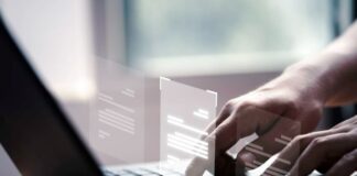 Why Companies Should Invest in Sentiment Analysis man on laptop using AI to invest in sentiment analysis