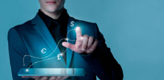 How to Kick-Start Digital Transformation in Banking businessman starting digital transformation in banking with a tablet