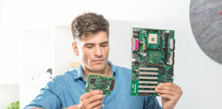 How to Choose the Right Computer Hardware for Your Business young man choosing the right computer hardware for his business