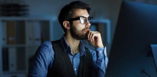 Time to Sell your Microsoft Business? man on computer looking to sell his Microsoft business