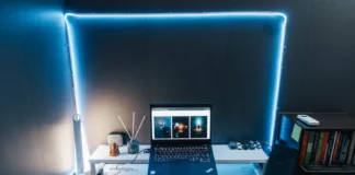 How to Choose the Perfect Mouse Pad A Computer Set on a White Table with Blue LED Lights on Background Near a Set of Books