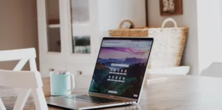 The Journey to Decentralized Social Media Network Laptop on the table representing decentralized social media