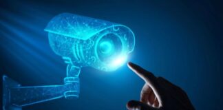 The Future of Security: Using AI to Enhance Monitoring and Recognition man touching virtual AI camera representing the future of security