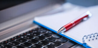 Technical Writing: A Key to Building the Foundation of Your Business a pen, notepad, and keyboard - the key to technical writing