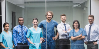 Unlocking the Potential of the Healthcare Workforce a bunch of smiling clinicians representing the healthcare workforce