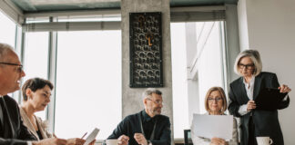 Exploring the Future of Business Connectivity with SD-WAN Solutions Colleagues discussing about SD WAN solutions