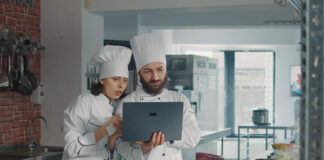 Pivoting My Passion for Restaurants to Tech-Fueled In-Home Fine Dining two chefs using tech to schedule and prepare In-Home Fine Dining