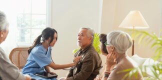 A Comprehensive Guide to Helping Others Navigate Medicare Enrollment nurse caregiver helping elderly with healthcare and Medicare enrollment