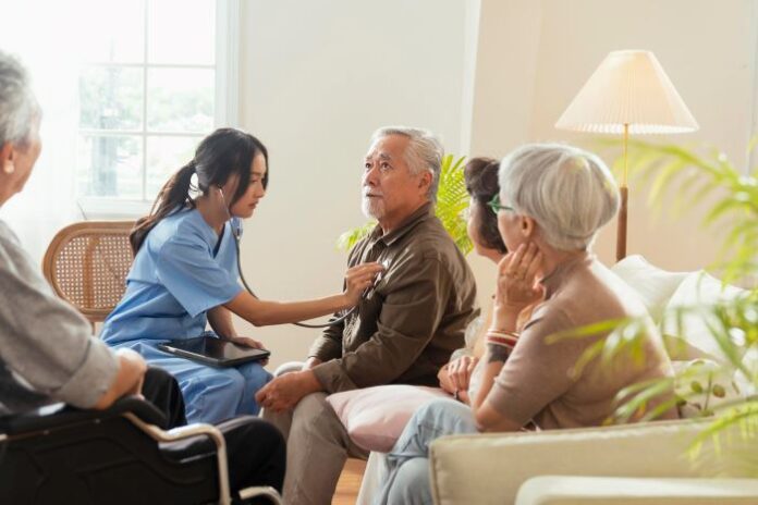 nurse caregiver helping elderly with healthcare and Medicare enrollment