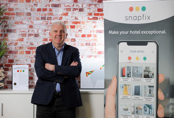 photo of CEO Paul McCarthy and Snapfix banner