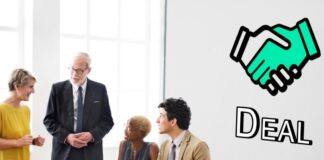 How To Ensure a Smooth Transition Post-Acquisition company employees meeting for a smooth transition Post-Acquisition of merger