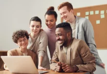 What Is Sales Enablement And Its Five Amazing Benefits? sales team smiling