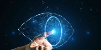 Consumer Demand Fuels the Rise of Visual Search Technology man pressing a digital eye representing visual search technology