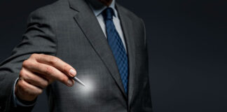 Cultivating Your Personal Brand: An Essential Guide for Professionals businessman holding a pen and cultivating Your Personal Brand