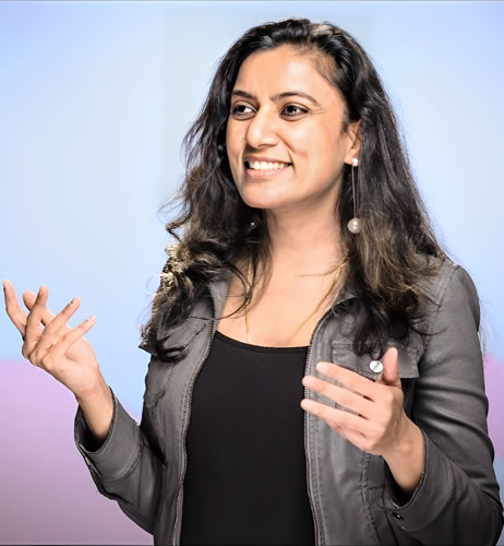 Surbhi Gupta speaking at a product event