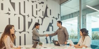 Winning SEO Strategy 2023: Finding the Right SEO Agency A Group of People Having a Meeting in the Office