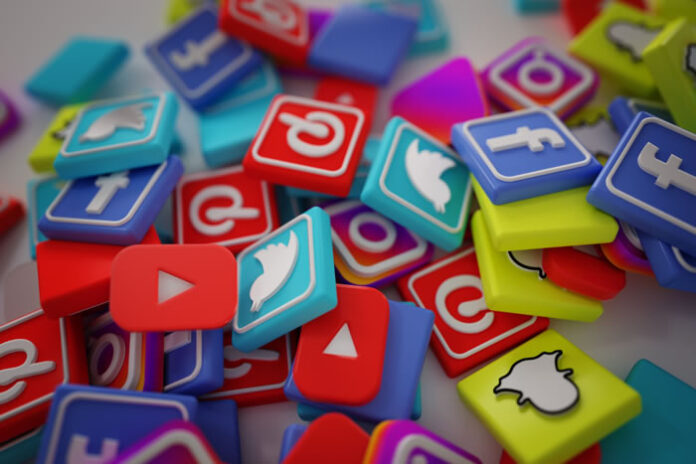 navigating social media and a pile of social media icons