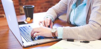 How to Start Your Career as a Web Designer Student typing on the keyboard with a career as a web designer