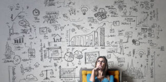 The Power of Passion, Purpose, and Expertise in Your Business woman sitting in chair thinking about the expertise in your business and the power of passion