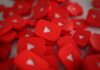 YouTube Marketing: Grow a Brand Channel through Packages a pile of red play buttons for YouTube marketing