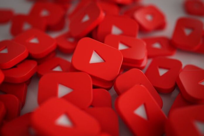 a pile of red play buttons for YouTube marketing