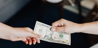 10 Important Things to Check Before Taking a LoanĀ Hands Holding a 10 Dollar Bill