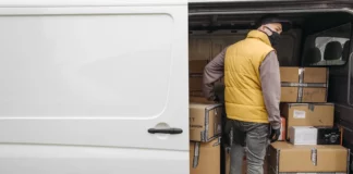 What Are Freight Services and Their Benefits? Man Standing Inside a Van with Packages
