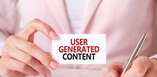 Marketers Prioritize User-Generated Content: A New Era of Engagement woman holding business card that says User-Generated Content