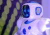 What is Conversational AI and the Future of Customer Service? a white and blue robot representing what is conversational AI