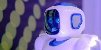 What is Conversational AI and the Future of Customer Service? a white and blue robot representing what is conversational AI