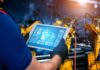 Knowledge Preservation in Manufacturing: A Roadmap for Success man on digital tablet working on Knowledge Preservation in Manufacturing