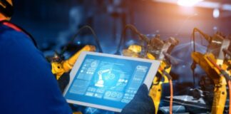 Knowledge Preservation in Manufacturing: A Roadmap for Success man on digital tablet working on Knowledge Preservation in Manufacturing