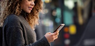Smartphones: Pioneering Energy Conservation girl using her smartphone and pioneering energy conservation.