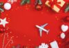 6 Ways to Ensure Network Security During Holiday Travel toy airplane on red holiday cover with Christmas holiday decorations for holiday travel