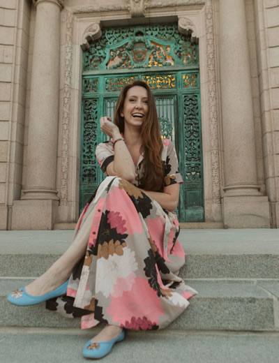 Rebecca Korn smiling on steps