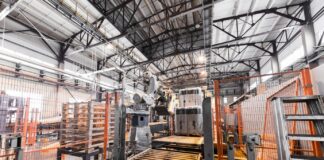 What Is a Conveyor System and What Are Its Major Uses? Modern operational plant equipment assembly line producing fiberglass heavy industry machinery metalworking