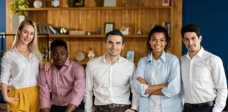 Onboarding Systems: Key to Employee Success smiling coworkers working to build better onboarding systems