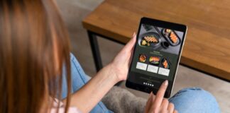 Shopify Dropshipping for Foodies: Niche Markets in Culinary Commerce woman sitting down, ordering online and using dropshipping