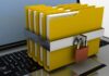 What Are the Things to Know About File Encryption?   file encryption represented with file folders locked on a laptop